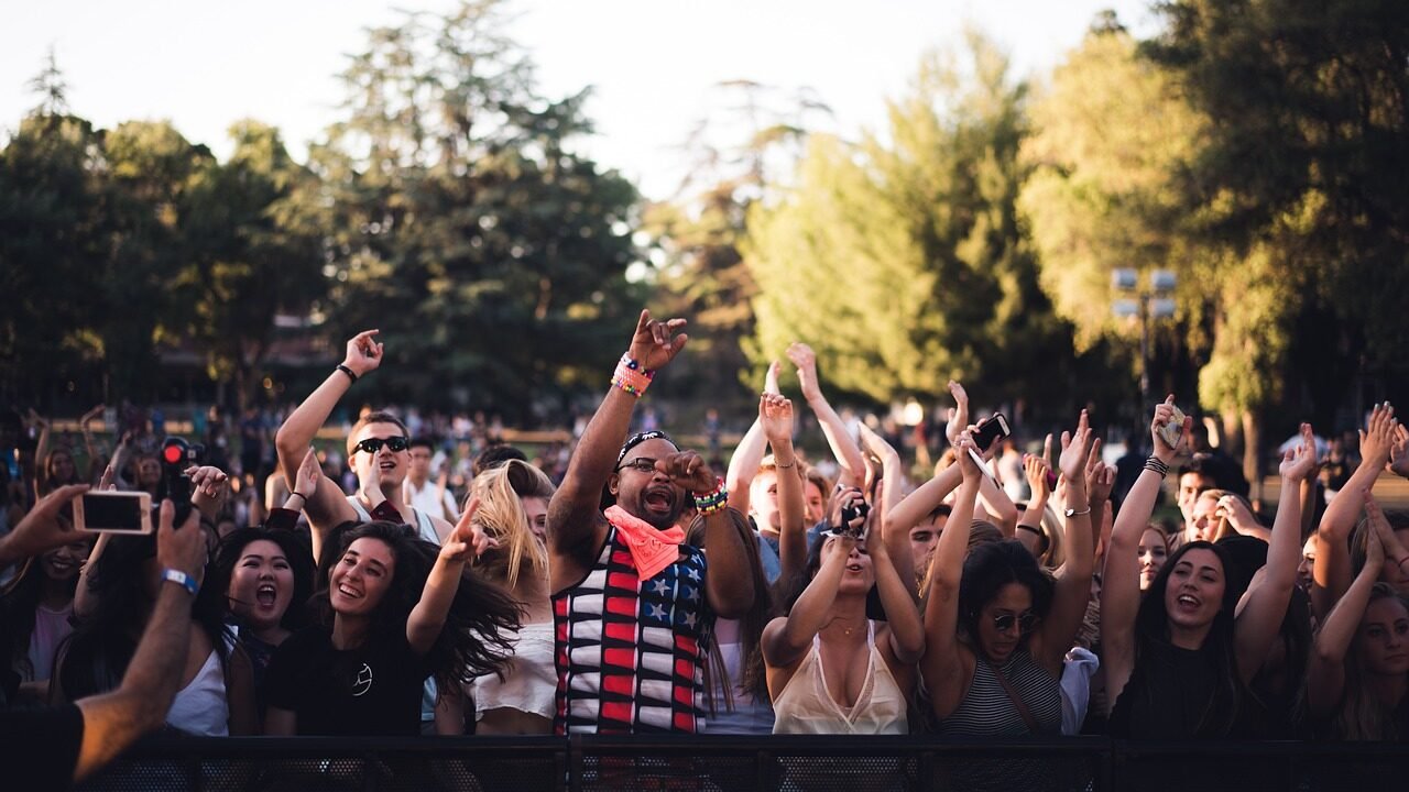 People watch a performance on a stage.