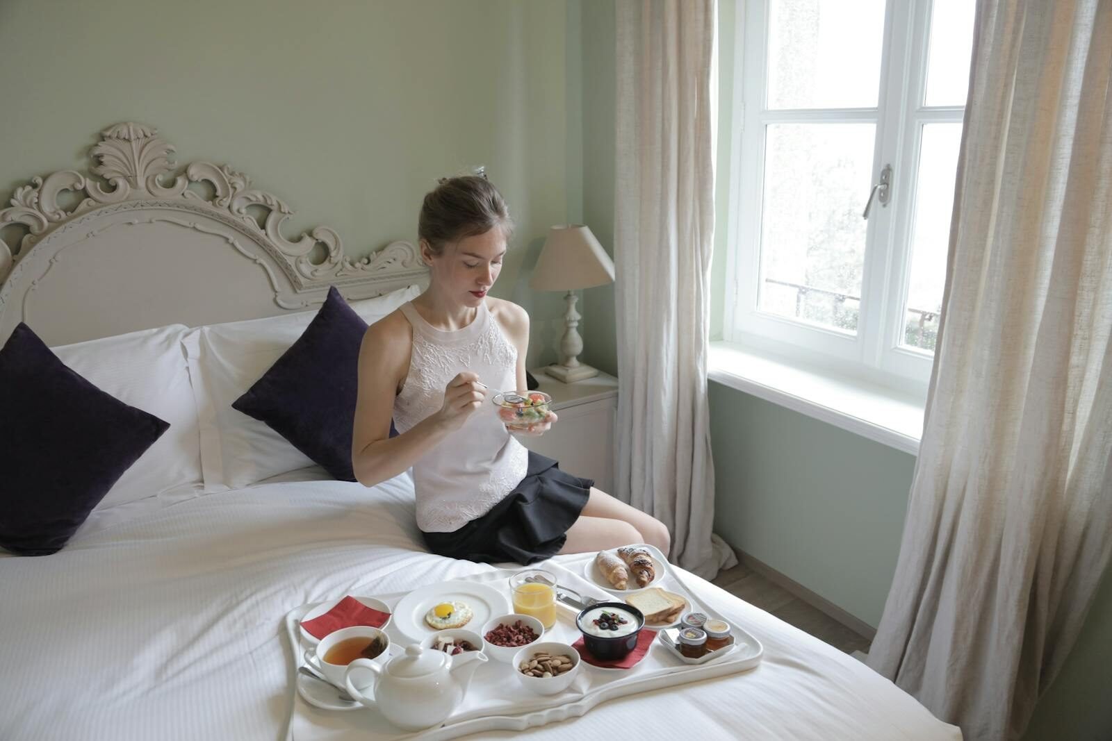 selective focus photography of burger patty, mayonnaise, and French fries served on platter