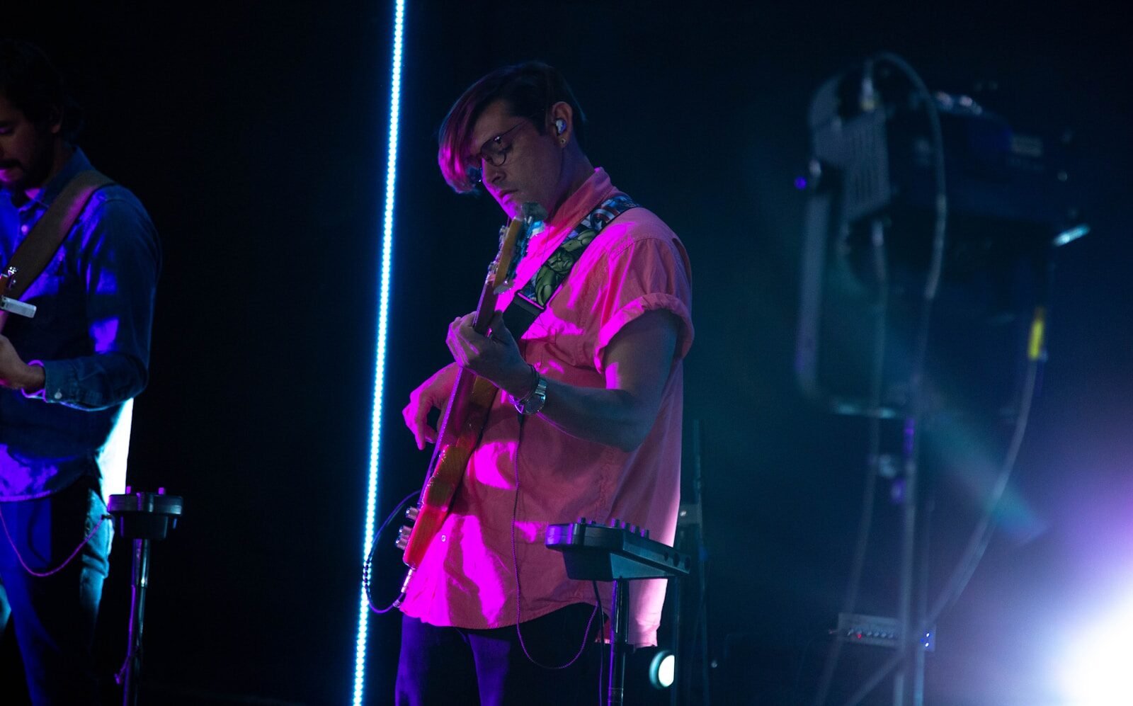 man in white t-shirt singing